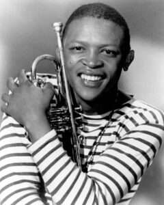 Hugh Masekela holding a trumpet