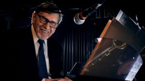 Bob Erlendson seated at a piano