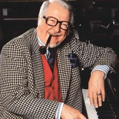 Jacques Diéval seated at the piano