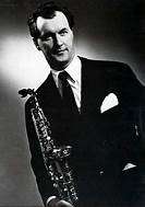 Arne Domnérus holding a saxophone