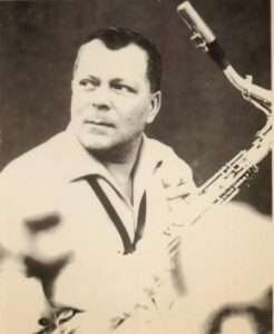 Hans Koller holding a saxophone