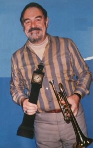 Bob Barnard holding a trumpet