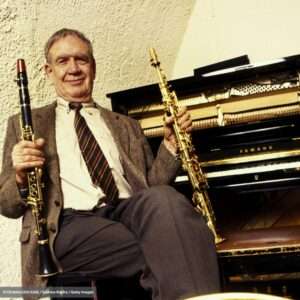 Claude Luter seated with clarinets
