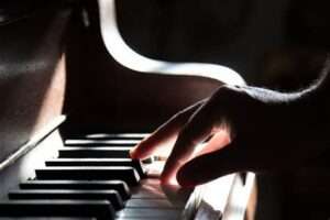 Hands on piano keys