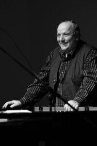 Bob Sedergreen playing piano