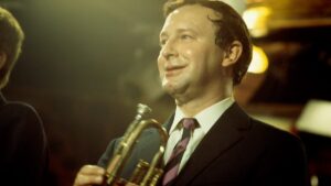 Alex Welsh holding a trumpet