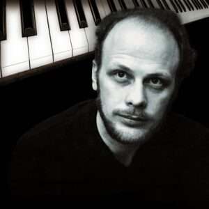 Jan Johansson portrait beside piano keys