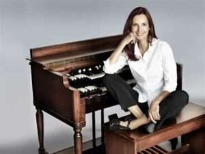 Barbara Dennerlein seated at a Hammond organ