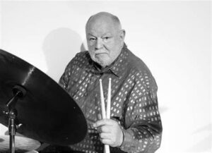 Daniel Humair seated at a drum kit