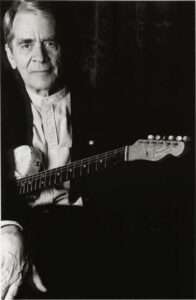 Ed Bickert holding a guitar