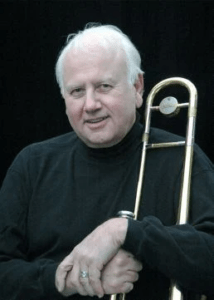 Ian McDougall holding a trombone