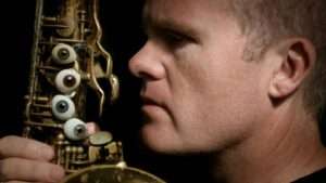 Iain Ballamy beside a saxophone