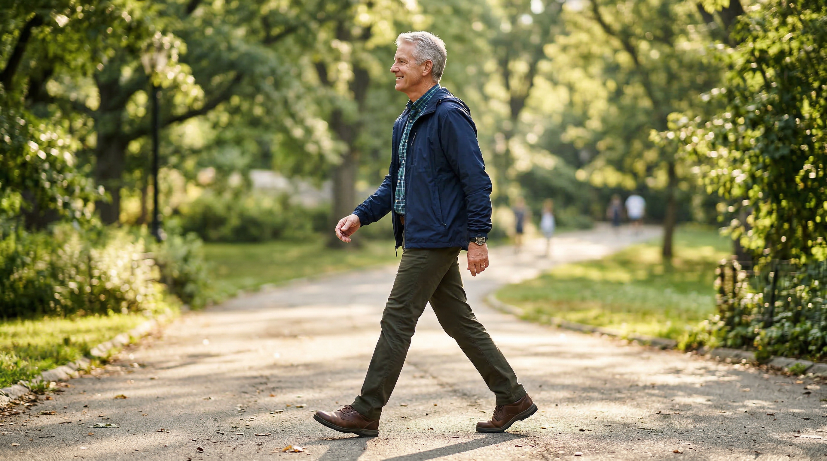 An active adult man walking upright in a beautiful park