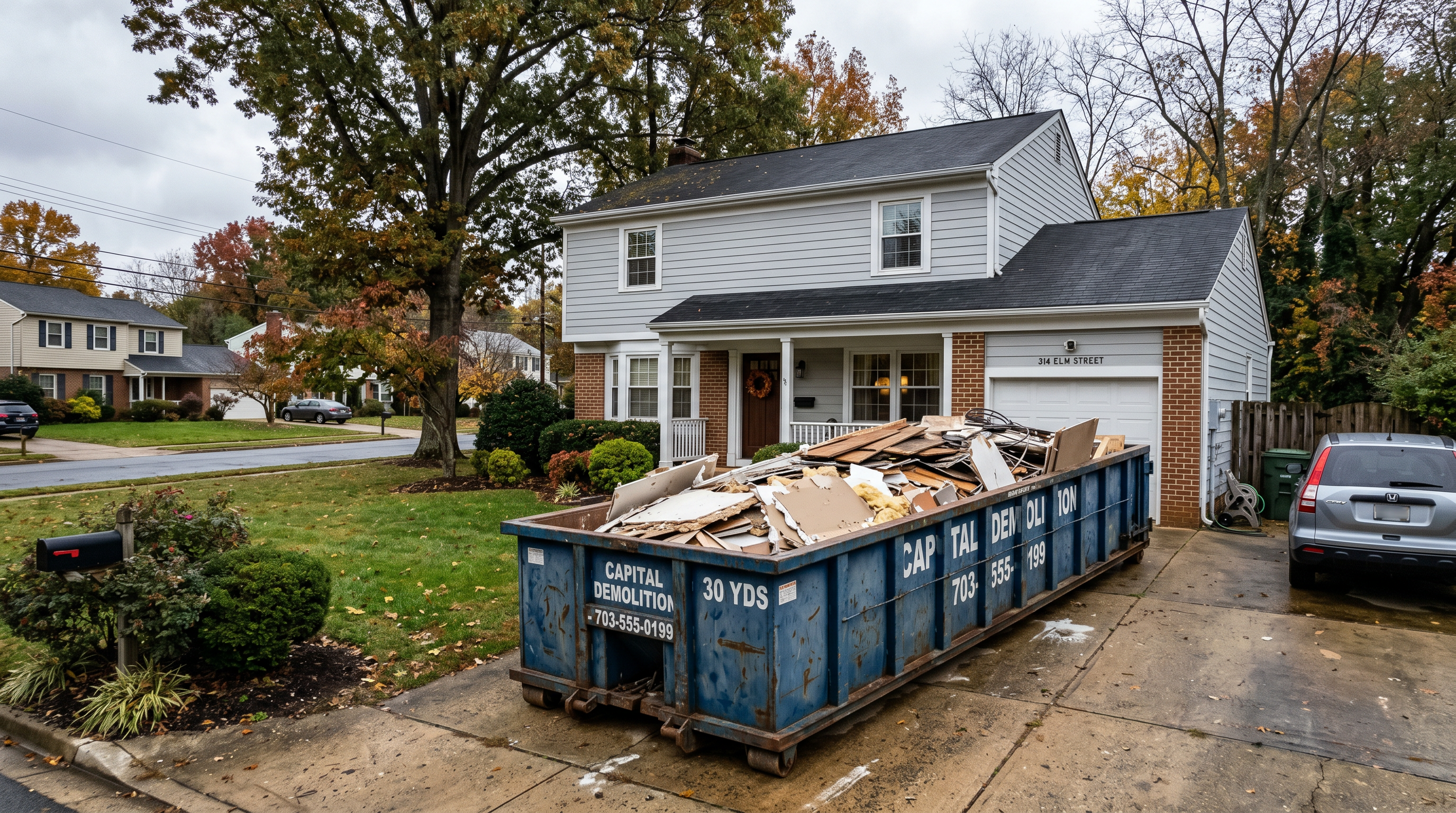 Third dumpster filled with renovation debris outside a Northern Virginia home