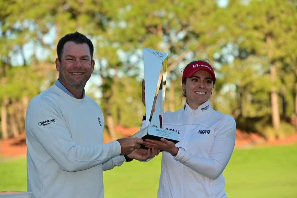 Mike Flaskey presenting a trophy at a celebrity tournament