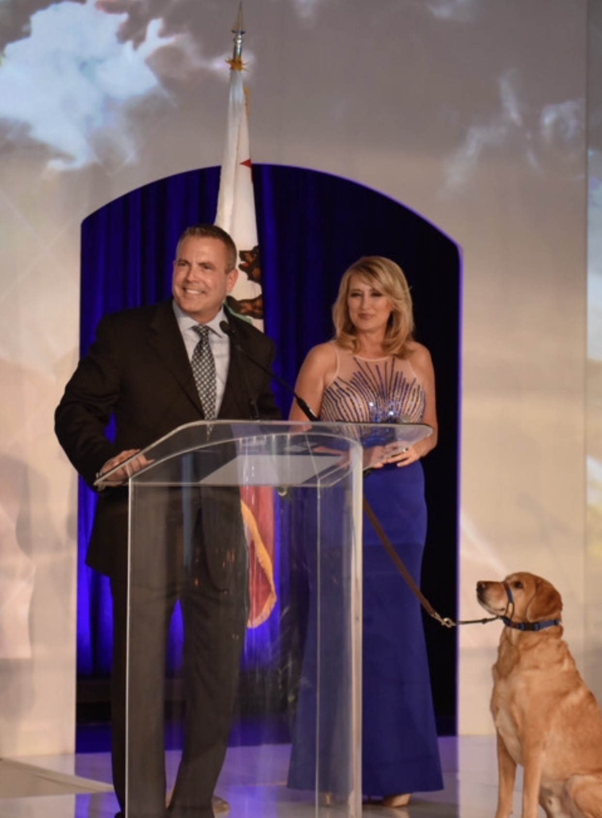 Brock at a formal podium event