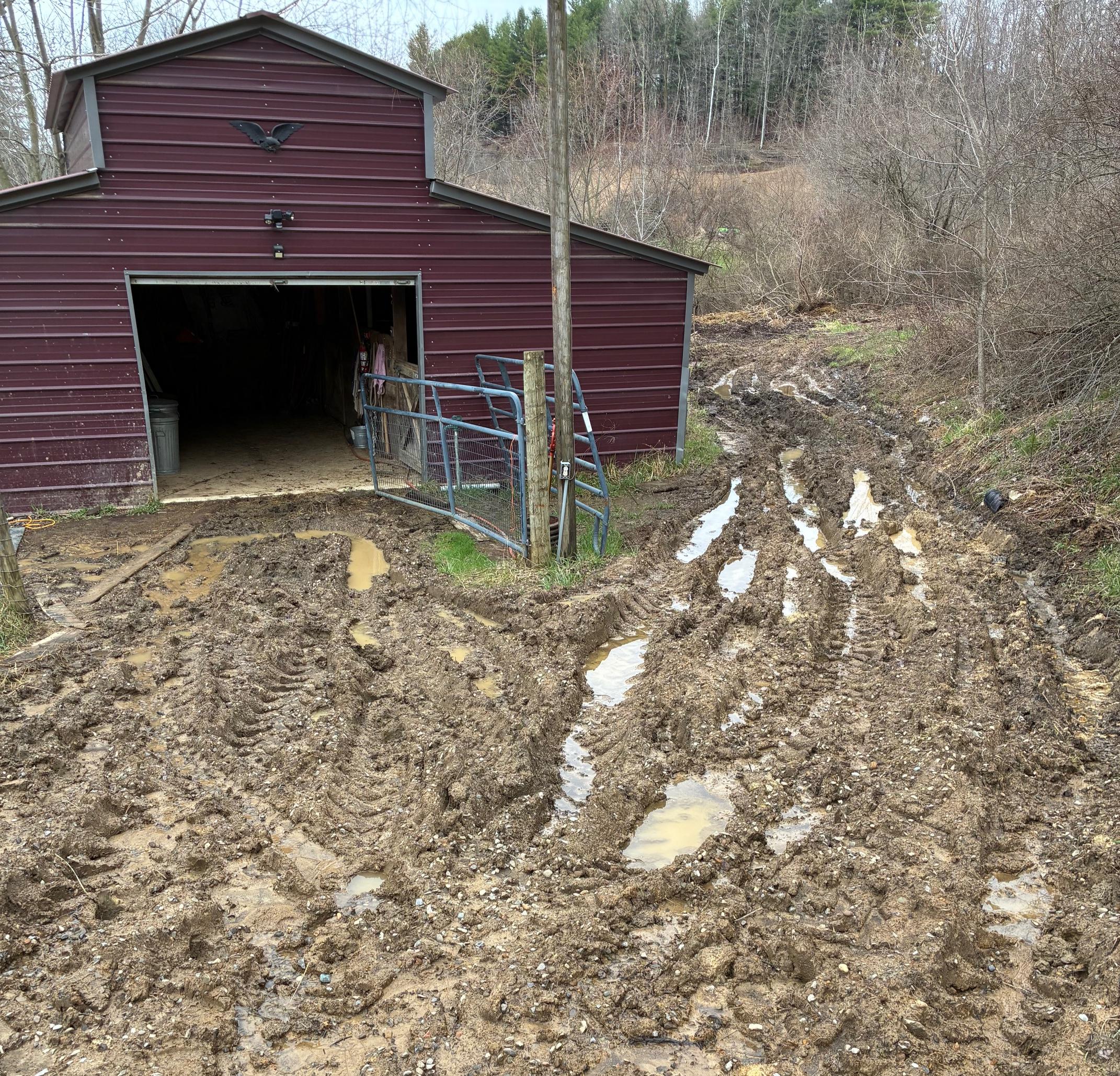Barn driveway — standing water throughout