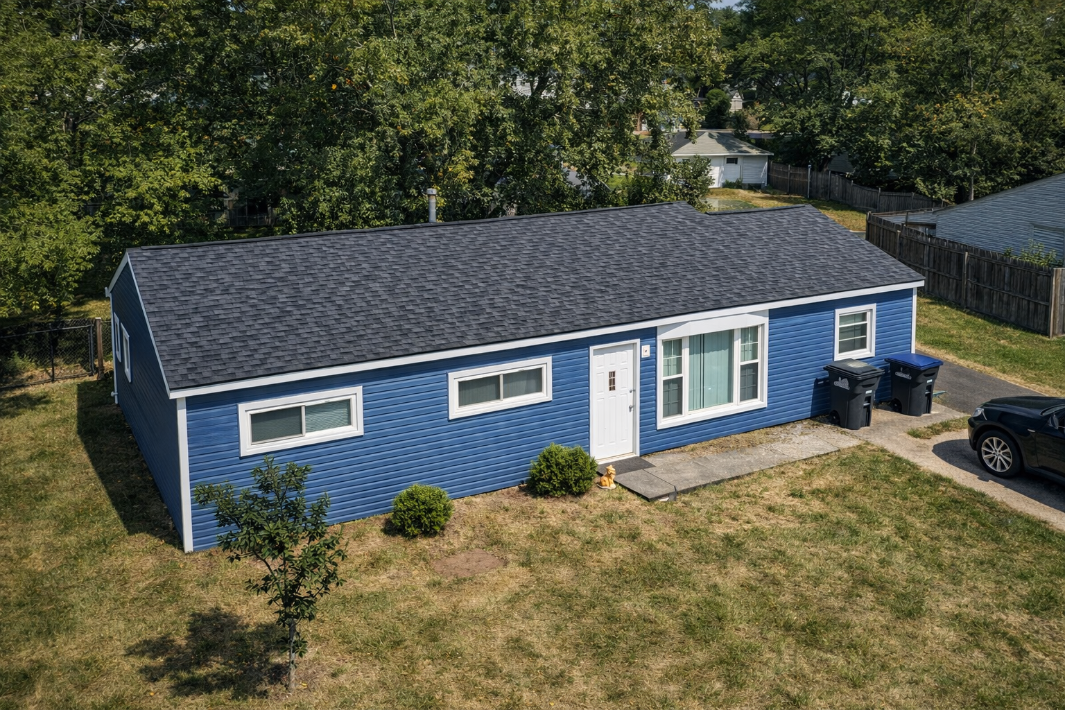 New charcoal shingle roof on a ranch home in Northeast Ohio