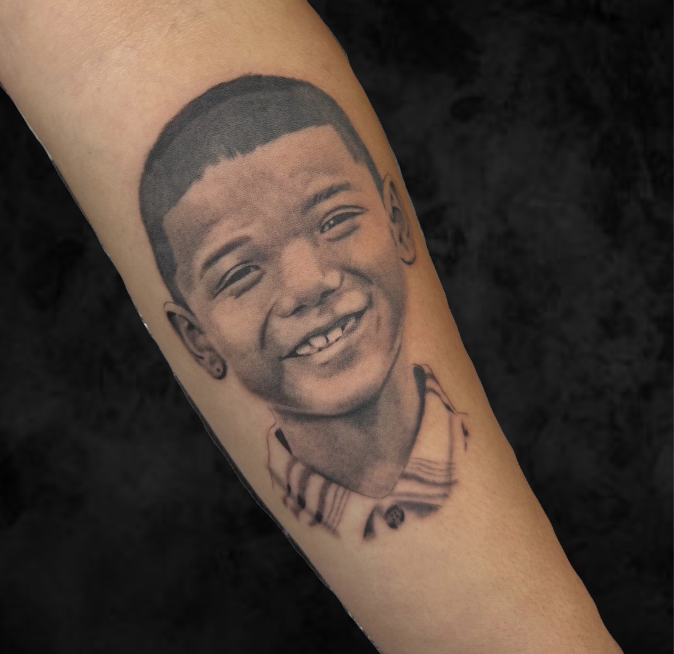 Marc Cabos Black and Grey Child Portrait Tattoo
