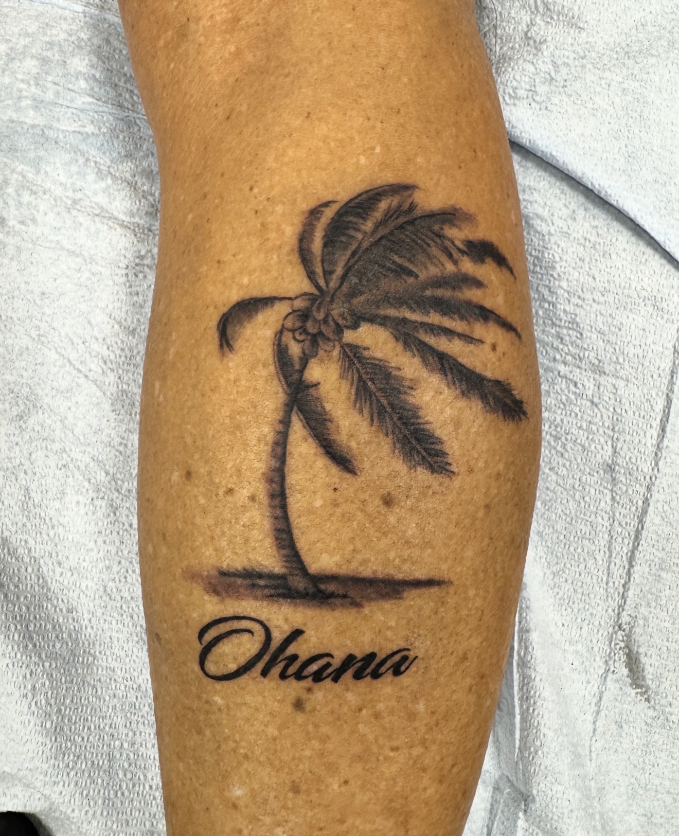 Palm tree Ohana tattoo by Marc Cabos