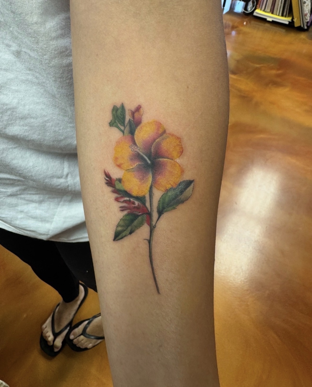 Color yellow hibiscus flower tattoo by Marc Cabos
