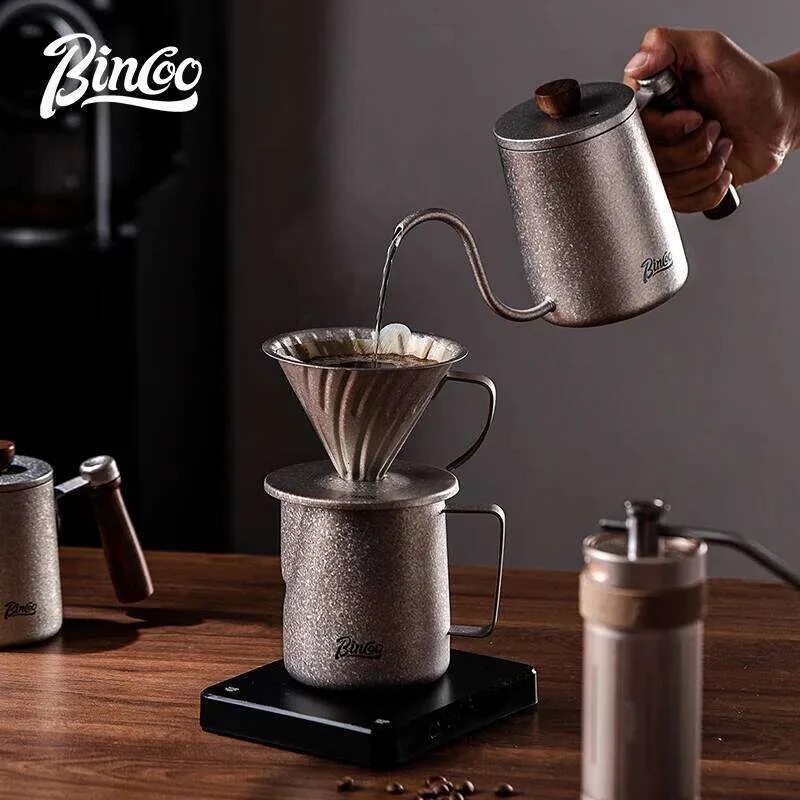 Titanium pour-over set with kettle, dripper, mug, and manual burr grinder