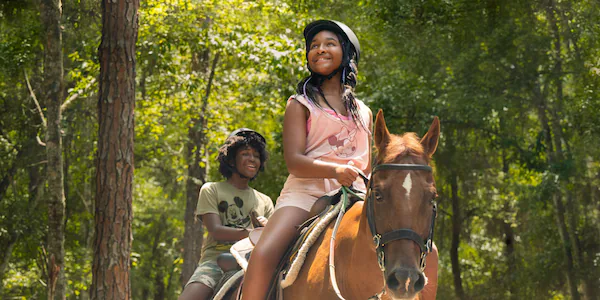 Horseback riding through the trails at Fort Wilderness