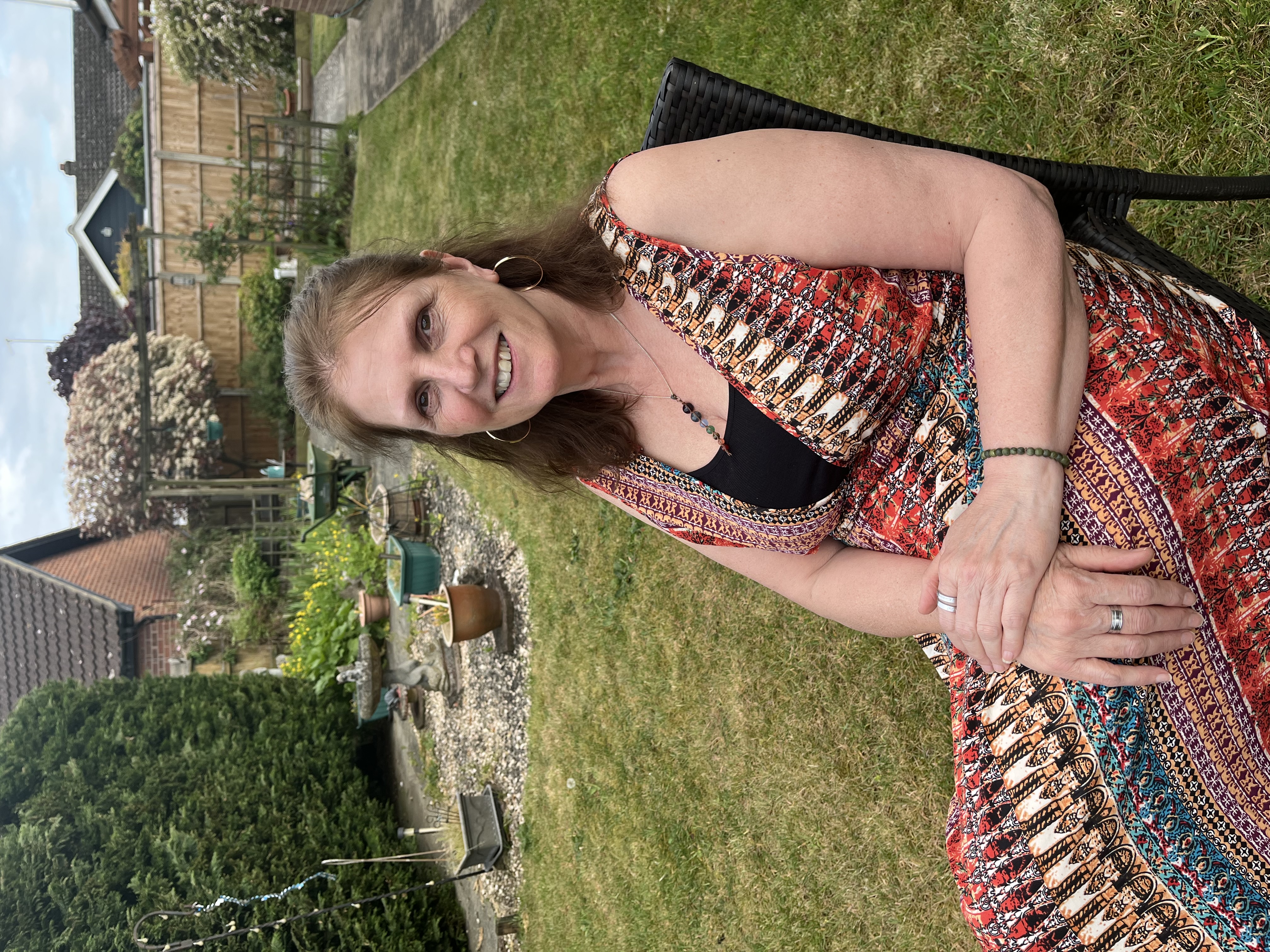 Gwen Gould smiling in her garden