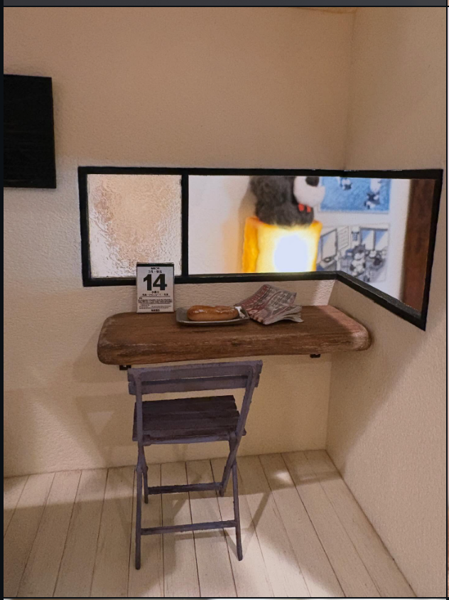 Miniature cafe window seat with a small chair, counter ledge, and handwritten menu