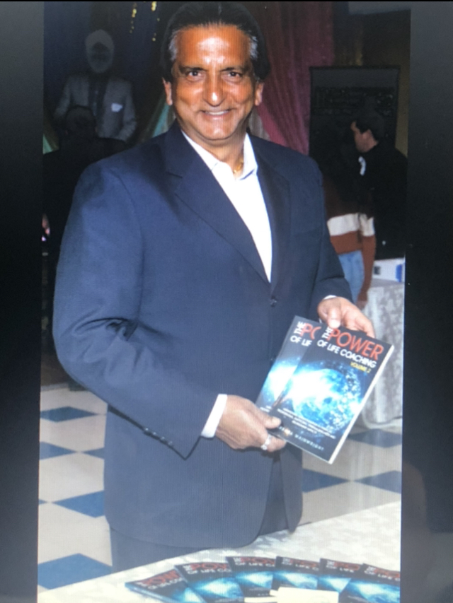 Paul Sahota with a copy of The Power of Life Coaching