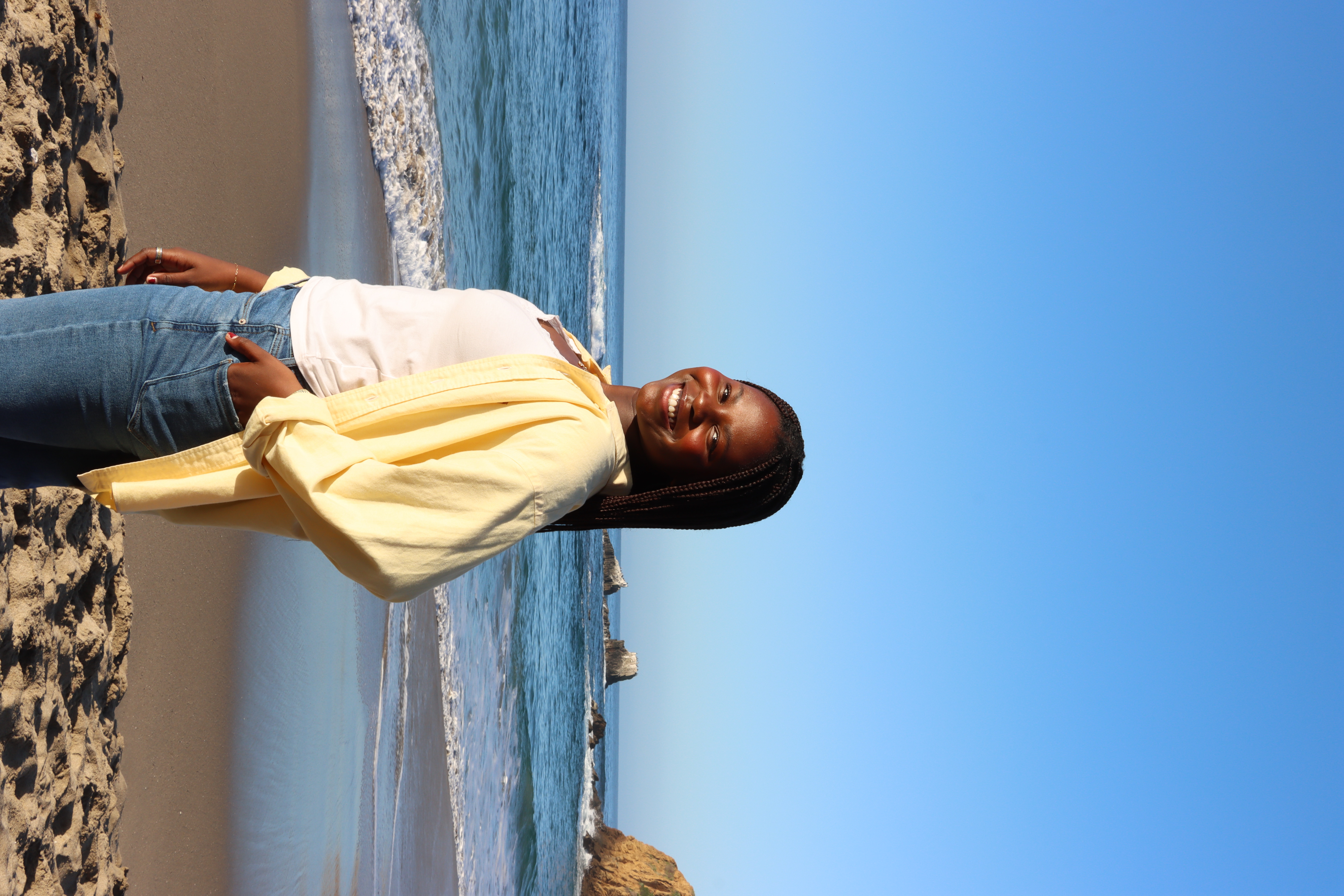 Anna standing by the ocean