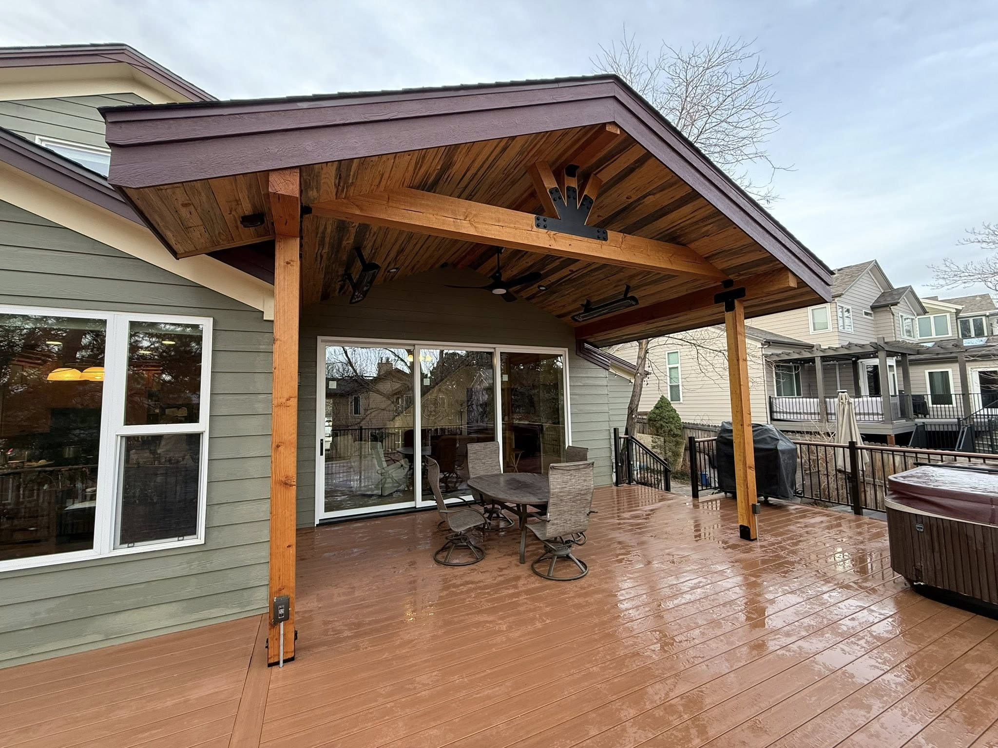 Custom covered deck with timber frame pergola and outdoor dining area