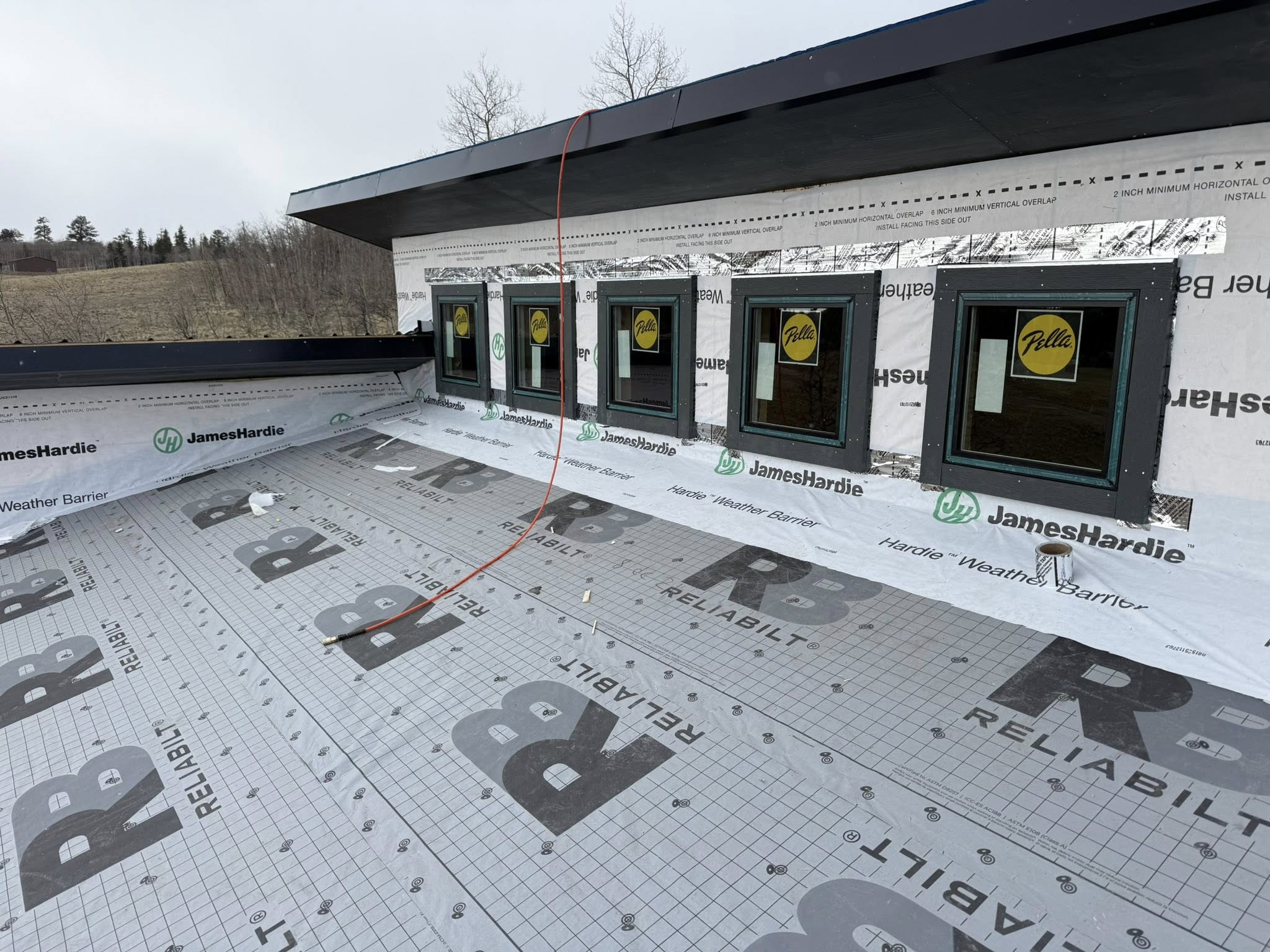 Home addition framing and siding installation with Pella windows