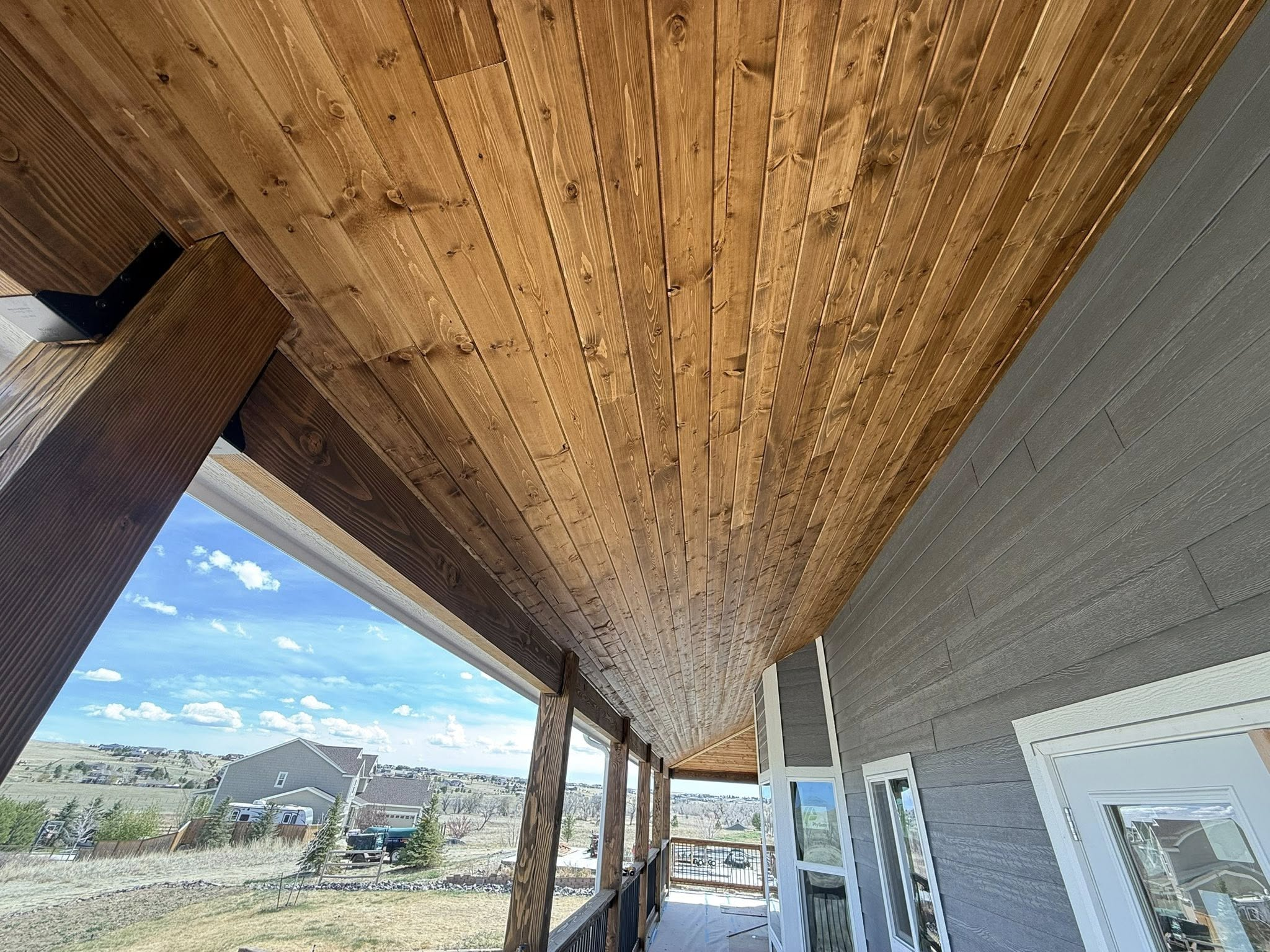 Covered porch with tongue-and-groove cedar ceiling and mountain views
