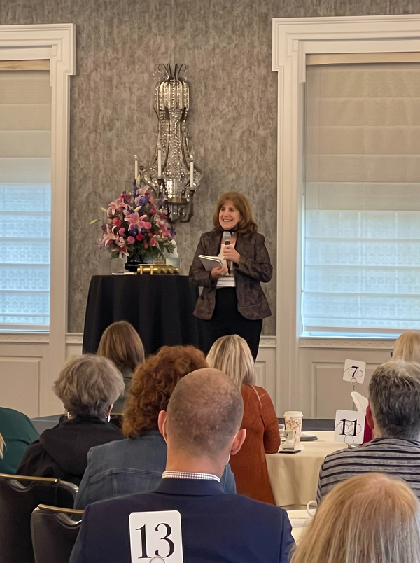 Suzanne speaking to an audience
