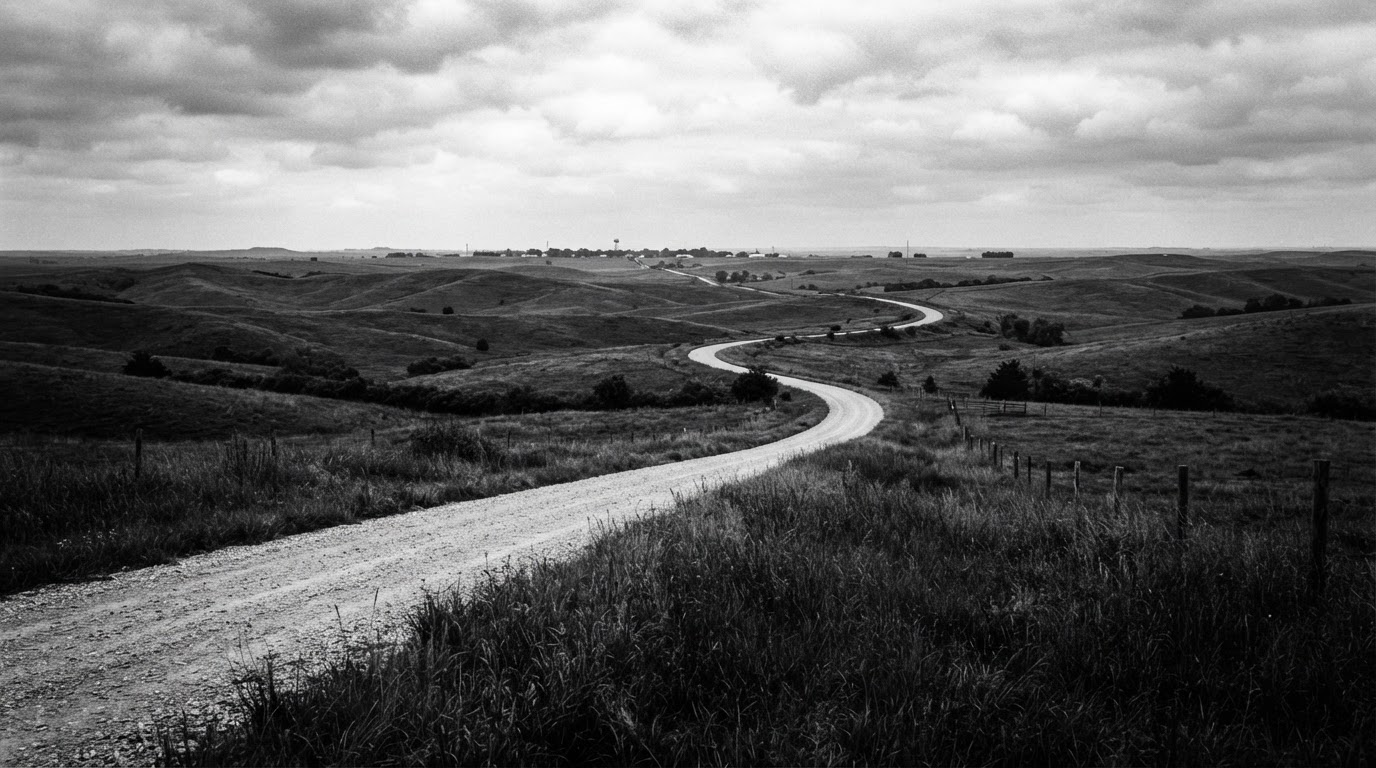 Quiet Northeast Kansas road through rolling prairie and farmland
