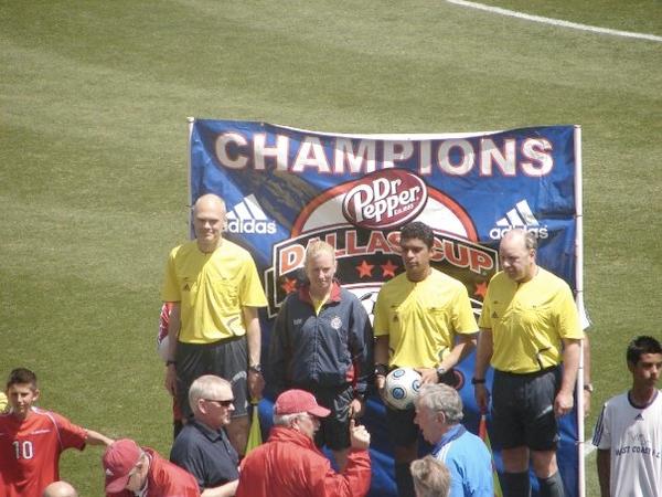 Football official standing outside a tournament venue
