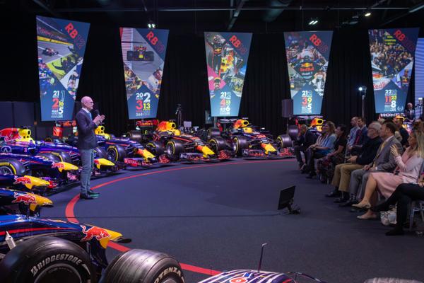 Formula 1 event stage with Red Bull cars and audience