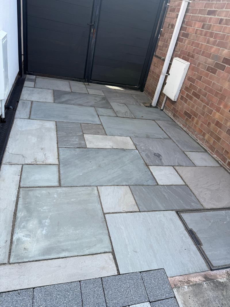 After photo of a cleaner, dry paved side path following clean-up