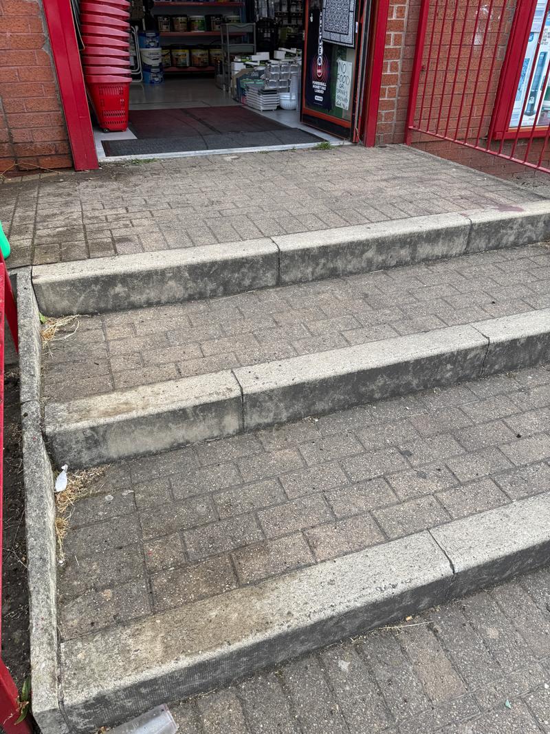 Before photo of close-up commercial entrance steps