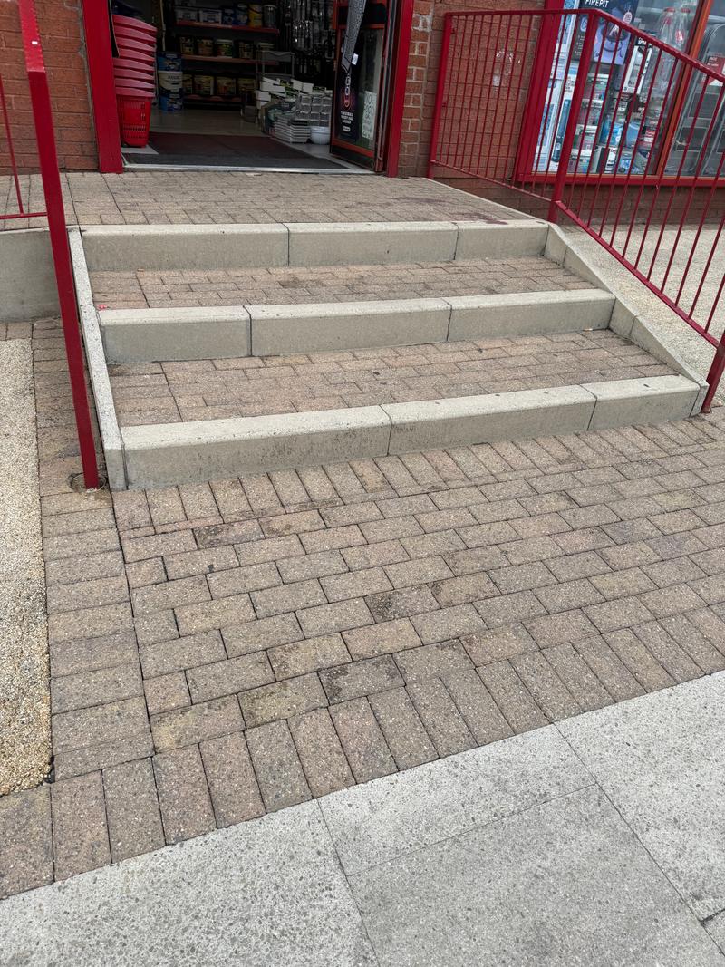 After photo of close-up commercial entrance steps following clean-up work