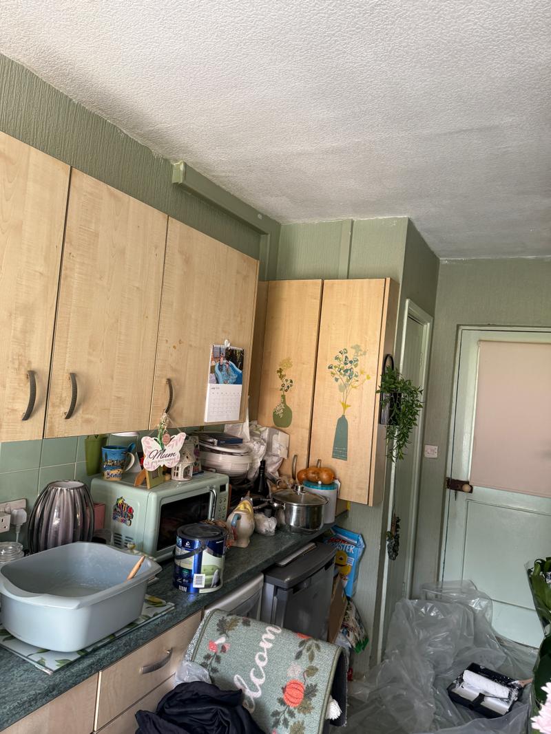 Before photo of an interior kitchen area before painting and decorating