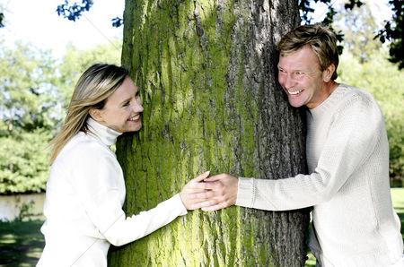 Courageous Couples guided audio by Paul Sahota, couple holding hands by tree