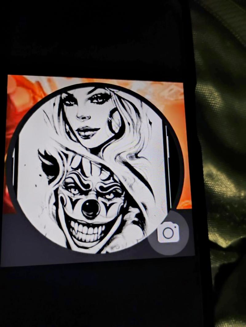 Circular black-and-white illustration showing a woman above a grinning joker face.