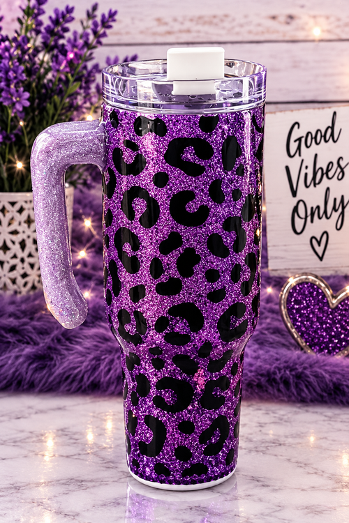 Purple glitter leopard-print tumbler with a clear handle