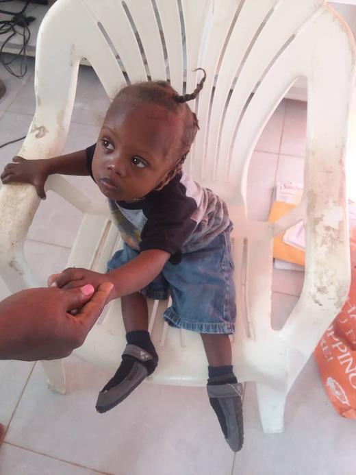 A young child receives attentive care in Haiti