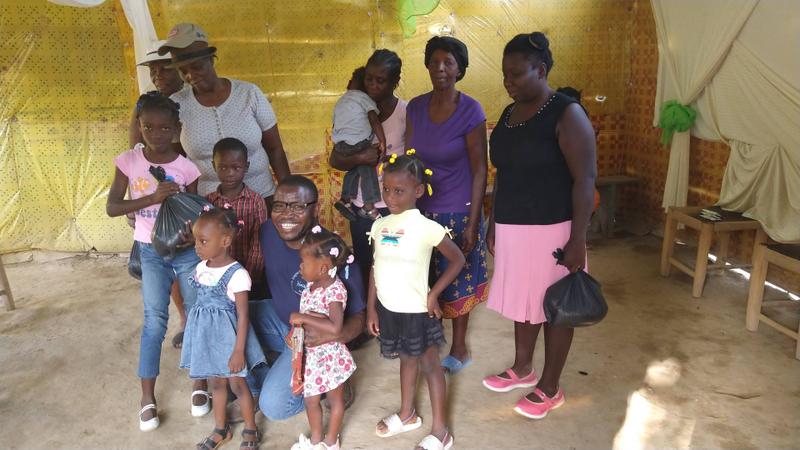 Families gather during ministry outreach in Haiti