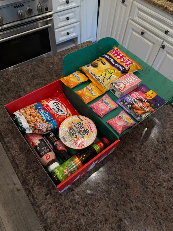 A selection of packaged snacks and pantry goods in a 99 Ranch Market gift box