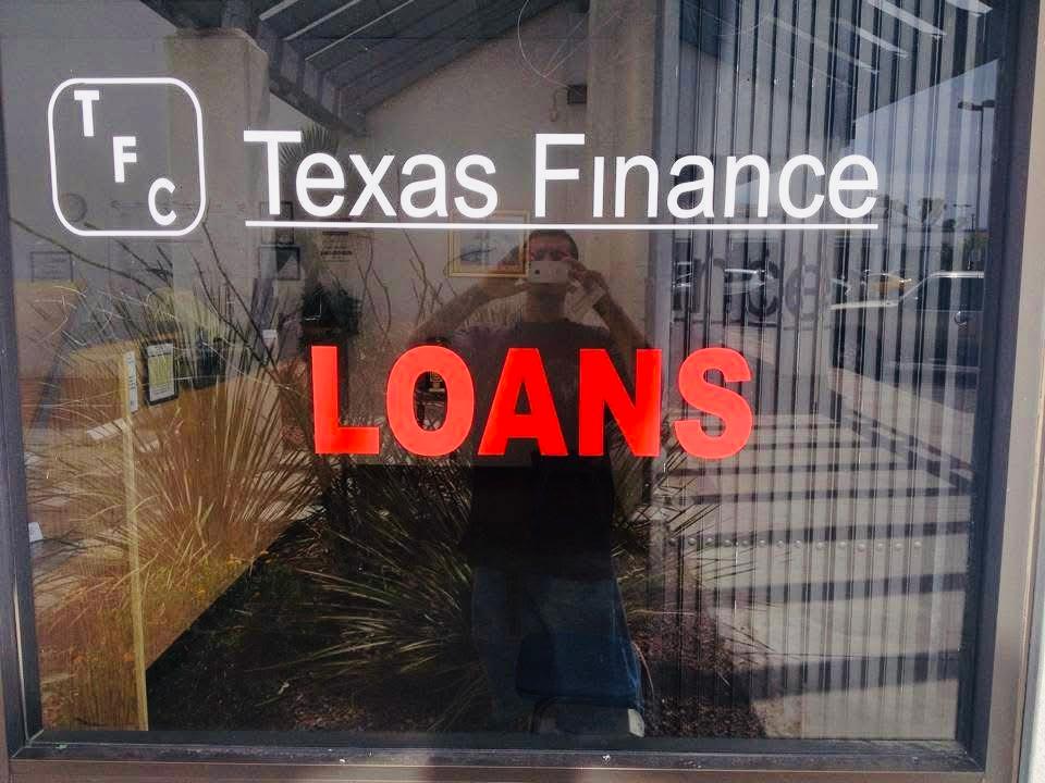Texas Finance and Loans lettering displayed across storefront glass.