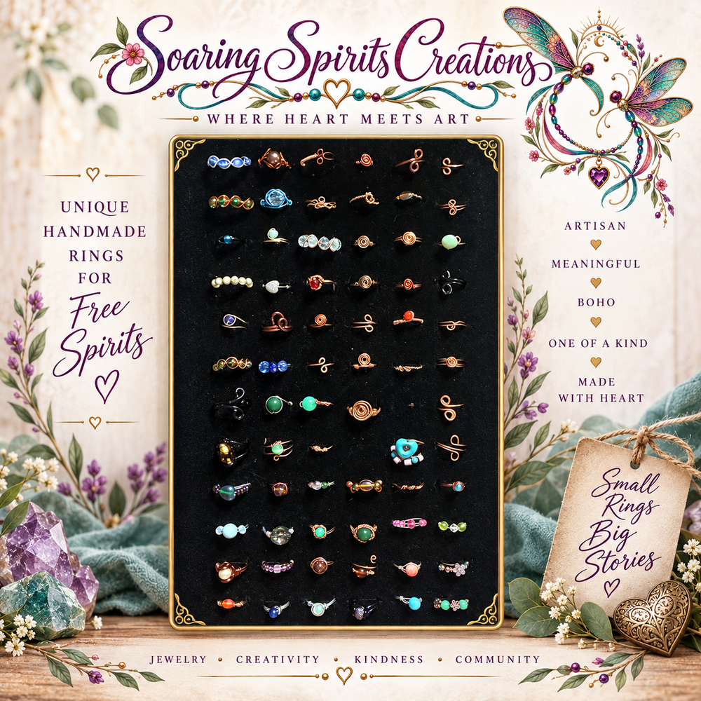 A display of many small rings on black velvet, surrounded by floral details, with Soaring Spirits Creations branding and Where Heart Meets Art text.